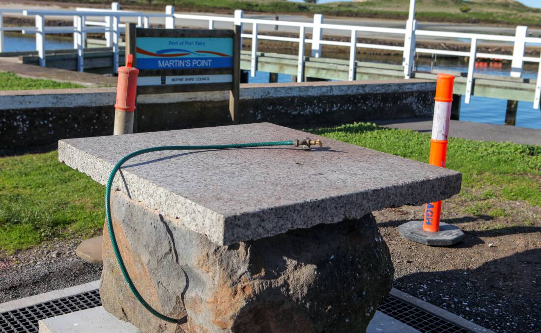 A new fish cleaning table being installed at Port Fairy. Facilities such as these are eligible for funding.
