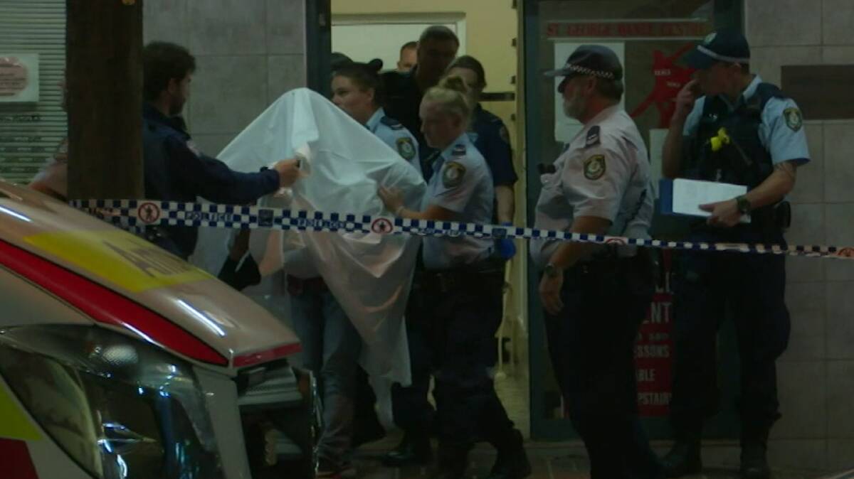 A man is led from the Arena building at Kogarah. Picture: 9News