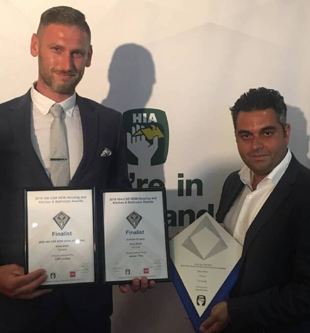 Vivid Built directors Kurt Kowaltschny (left) and Joe Romanous with their HIA award and finalist nominations at Star City. Picture: Supplied