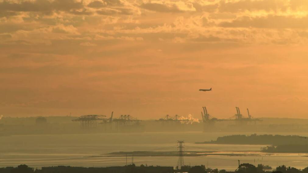 Smoke blankets Port Botany and the Sydney basin on Wednesday as a result of the burns west of Sydney. Picture: AAP