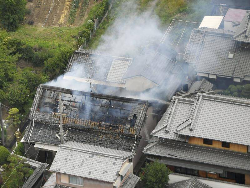 A home caught on fire after a quake struck the western Japan city of Osaka, killing three.