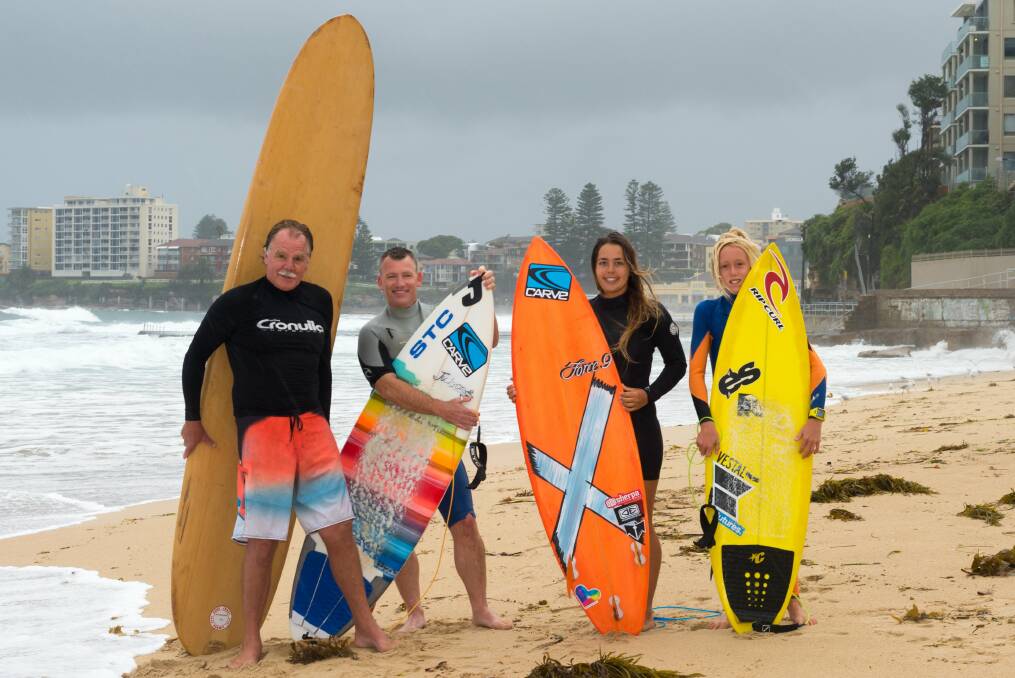 Nostalgic event: Celebrating 100 years since Duke Kahanamoku first surfed at Cronulla on February 7, 1915, are (left to right) Jeff Williams, Ian Spencer, Paris Whittaker and Jay Brown at North Cronulla beach, where surfing first occurred. Picture: Michael Sutton