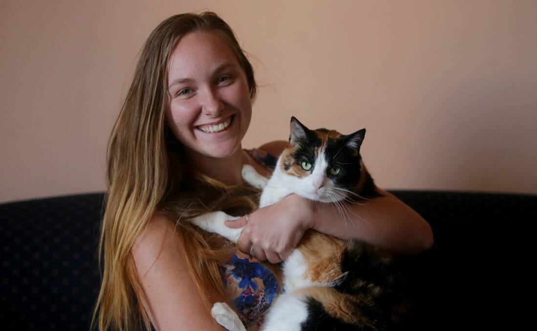Purr-fect job: Alyssa Woodland's love of animals has led her to online work. Picture: Chris Lane