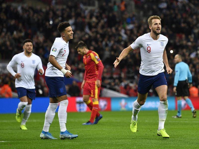 Harry Kane (R) scored a hat-trick in England's 7-0 Euro 2020 qualifying win over Montenegro.