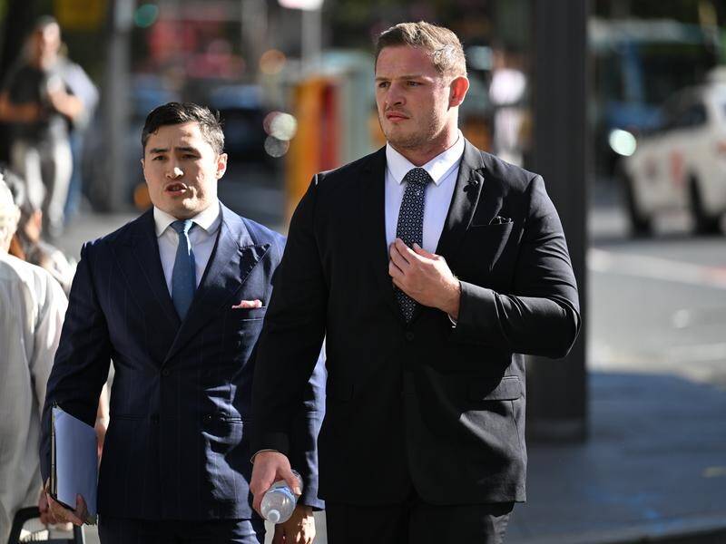 George Burgess (right) has denied in court that he touched a woman's buttocks. (Dean Lewins/AAP PHOTOS)