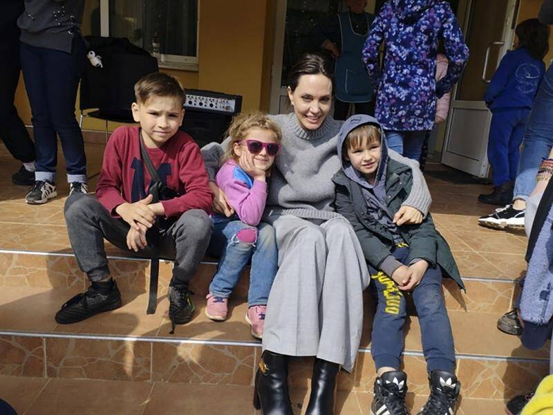 UNHCR goodwill ambassador Angelina Jolie posed for photos with children in Lviv, Ukraine.