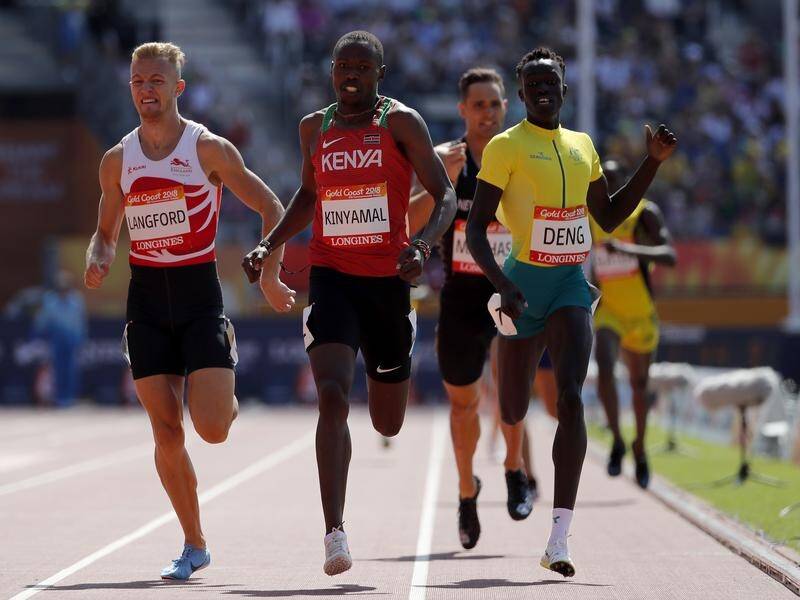 Australia's Joseph Deng (r) gets to the finish line in the men's 800m heat at Carrara Stadium.