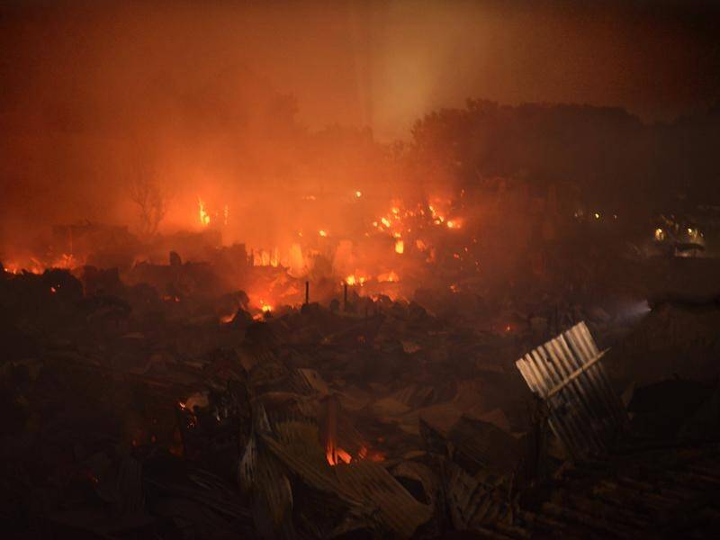 Flames engulf a shanty town at Mirpur in Dhaka, Bangladesh, leaving about 3000 people homeless.