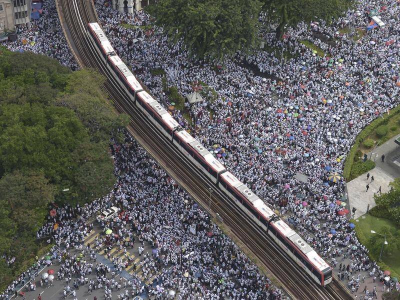 Tens of thousands of Malaysian Muslims have protested in Kuala Lumpur.