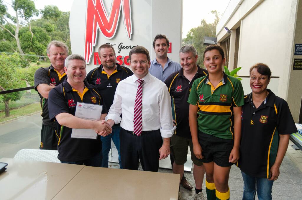 Get active: Oatley MP Mark Coure (above centre) with sports grants recipients.