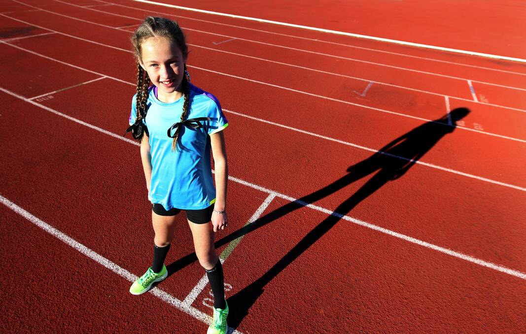 World-record runner: Imogen Stewart, 8, at Sylvania Waters Athletic Field. Picture: John Veage

