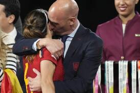 Spanish FA chief Luis Rubiales (hugging Aitana Bonmati) has apologised for kissing Jenni Hermoso. (AP PHOTO)