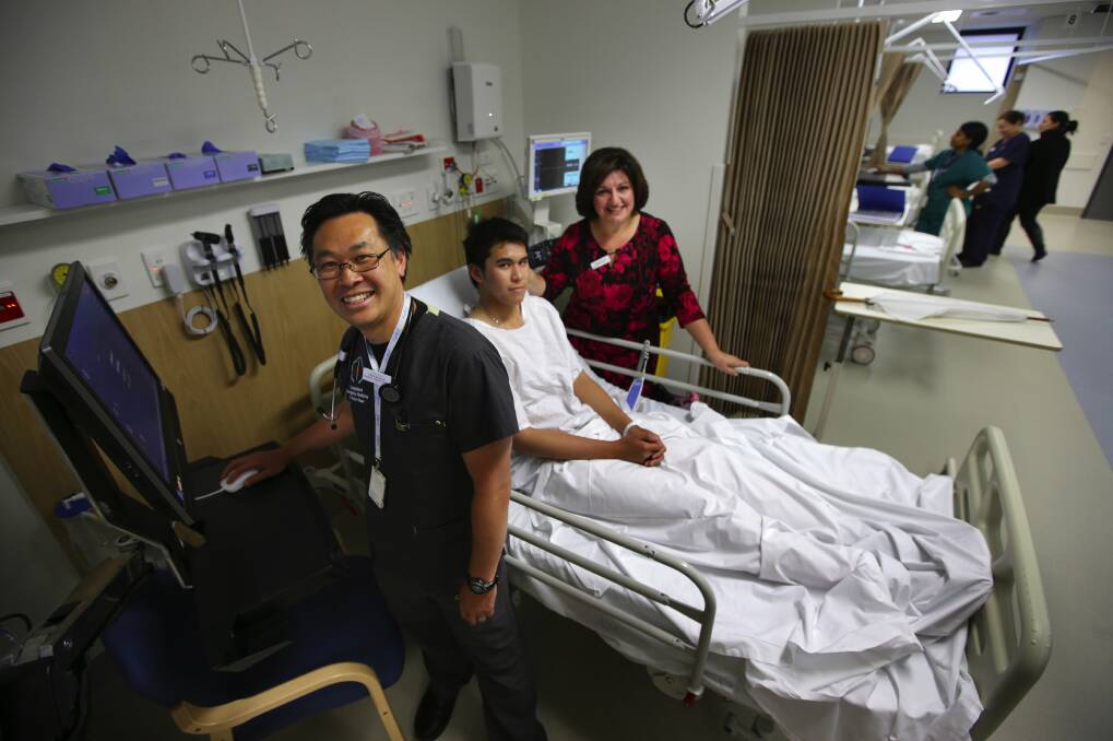 New department, first patient: Adithep Phaktham with emergency department director Dr Trevor Chan and senior nurse manager Antoinette Borg.Picture: John Veage