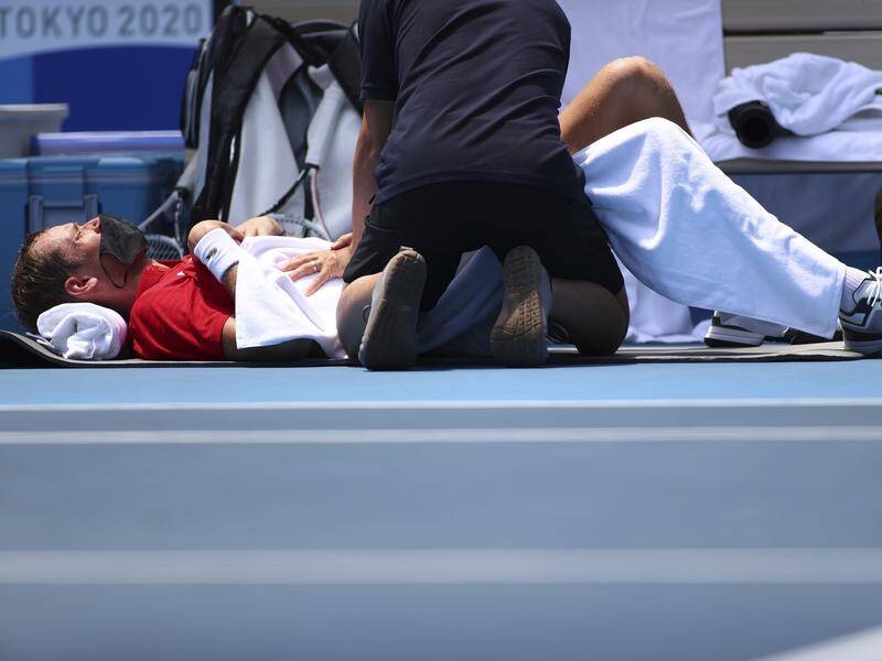 Daniil Medvedev gets medical treatment, struggling with the heat and humidity in Olympic tennis.