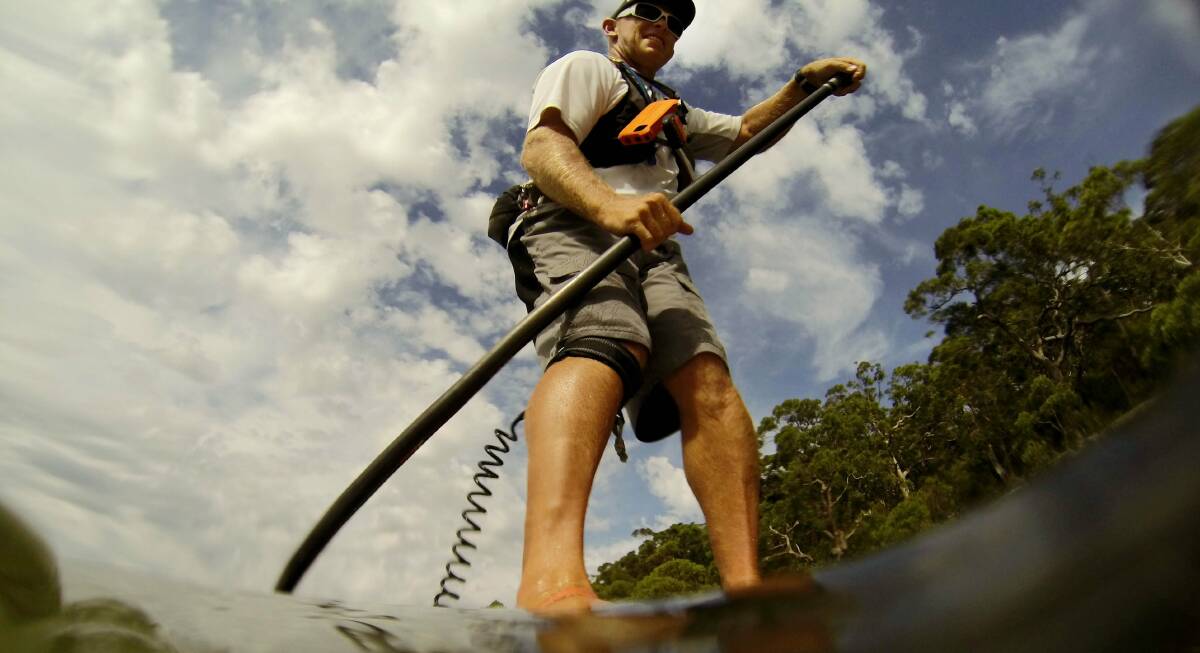 River health: Stuart Murray is checking on river health by paddleboarding around Sydney. Picture Chris Lane