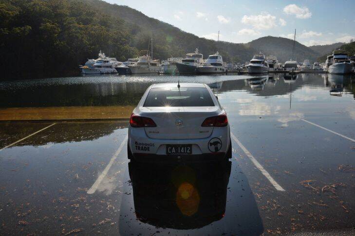 A very high tide catches out unwary drivers at Apple Tree Bay in the Ku Ring Gai National Park. Pic Nick Moir 01 jan 2017