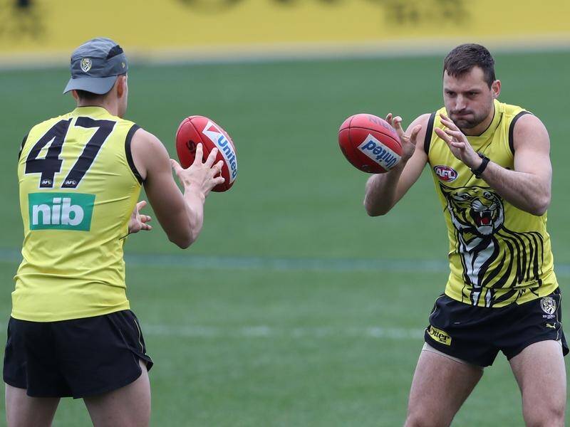 Toby Nankervis (right) has been ruled out of Richmond's clash with West Coast due to injury.