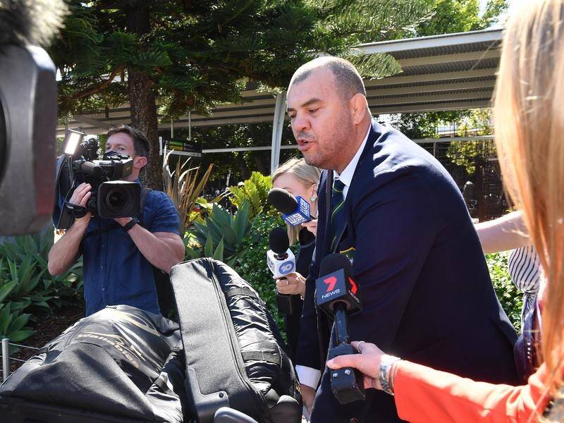 Outgoing Wallabies coach Michael Cheika addresses the media on his arrival in Sydney on Tuesday.