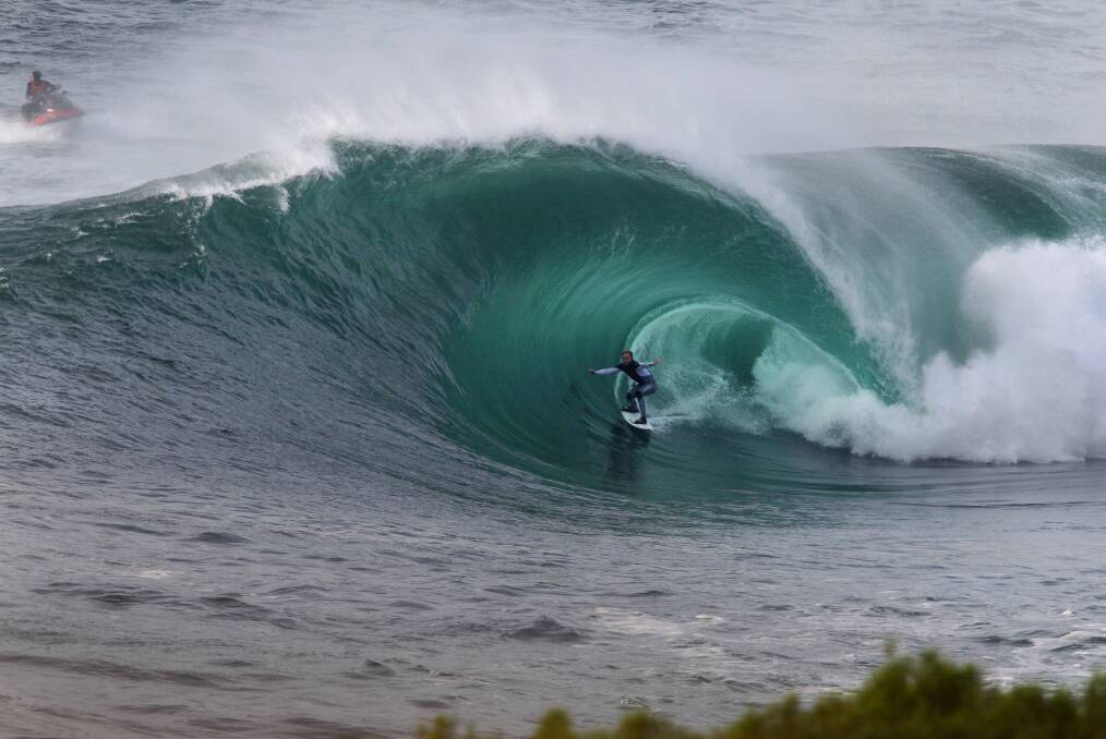 Swell: Mark Mathews in a spectacular barrel off Cape Fear recently. Picture: John Veage