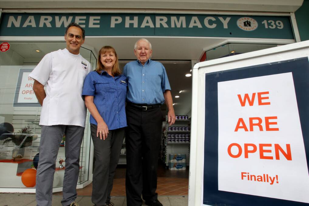 From the ashes: Joe Keledjian, Linda Lloyd and Fred Lloyd at Narwee Pharmacy which has reopened after a fire. Picture: Jane Dyson
