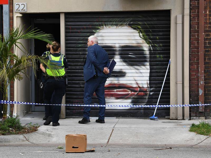 Police raided 12 properties connected to the Mongols bikies and charged two men with murder.