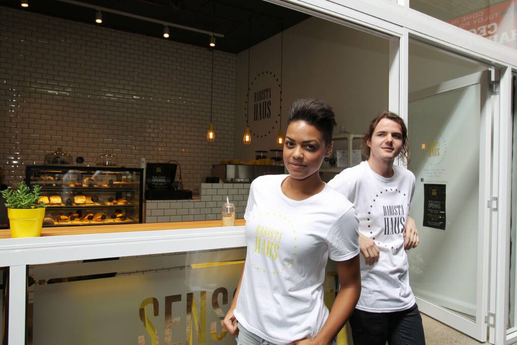 All about the bean: Baristas Natalie Ajanlekoko and Nathan Swan take coffee very seriously. Picture: Chris Lane