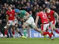 Ireland's Tadhg Beirne powers in for a try in theiir hammering of Wales at Dublin's Aviva Stadium. (AP PHOTO)