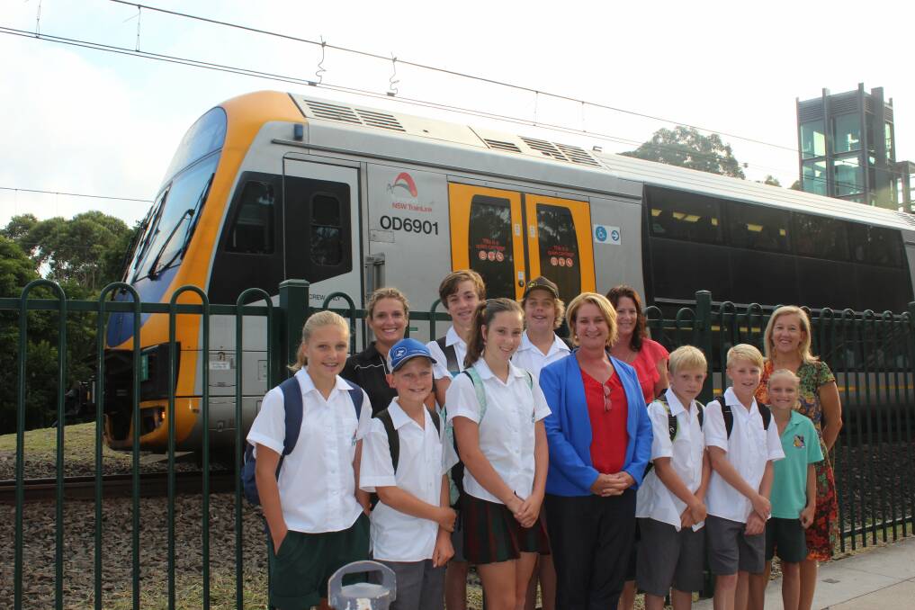 Bus promise: Labor candidate for Heathcote  Maryanne Stuart and students at Helensburgh station.