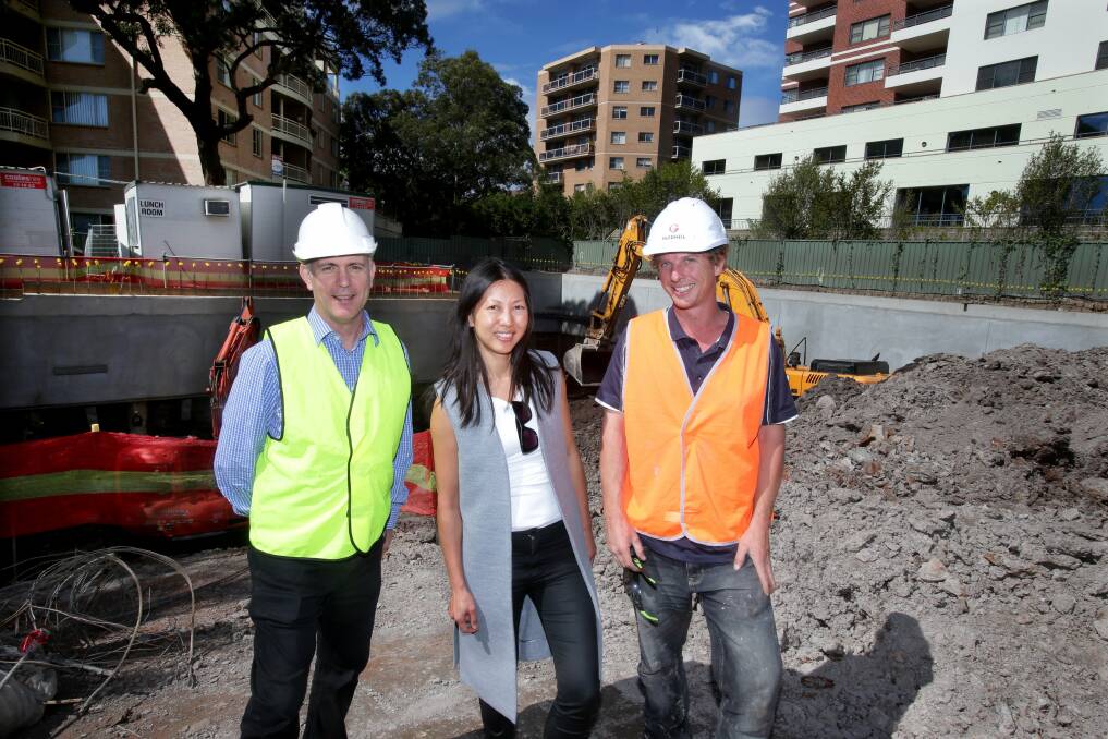 Helping with affordable housing: George Bakopoulos and Agnes Yi from St George Community Housing with site sub-foreman Lee Henderson at the Sutherland site. Picture: Jane Dyson