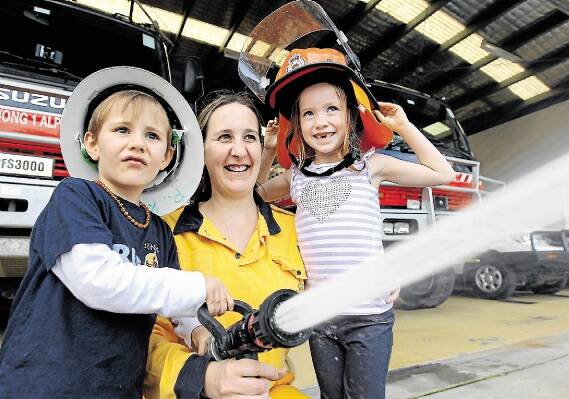 Family fun: Tyson and Mykaelah are pictured with Danielle Meggos at a past fun day at Sutherland Fire Station. Picture: John Veage
