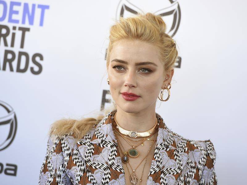 Amber Heard should not be excluded from attending Johnny Depp's libel trial, a UK judge says.
