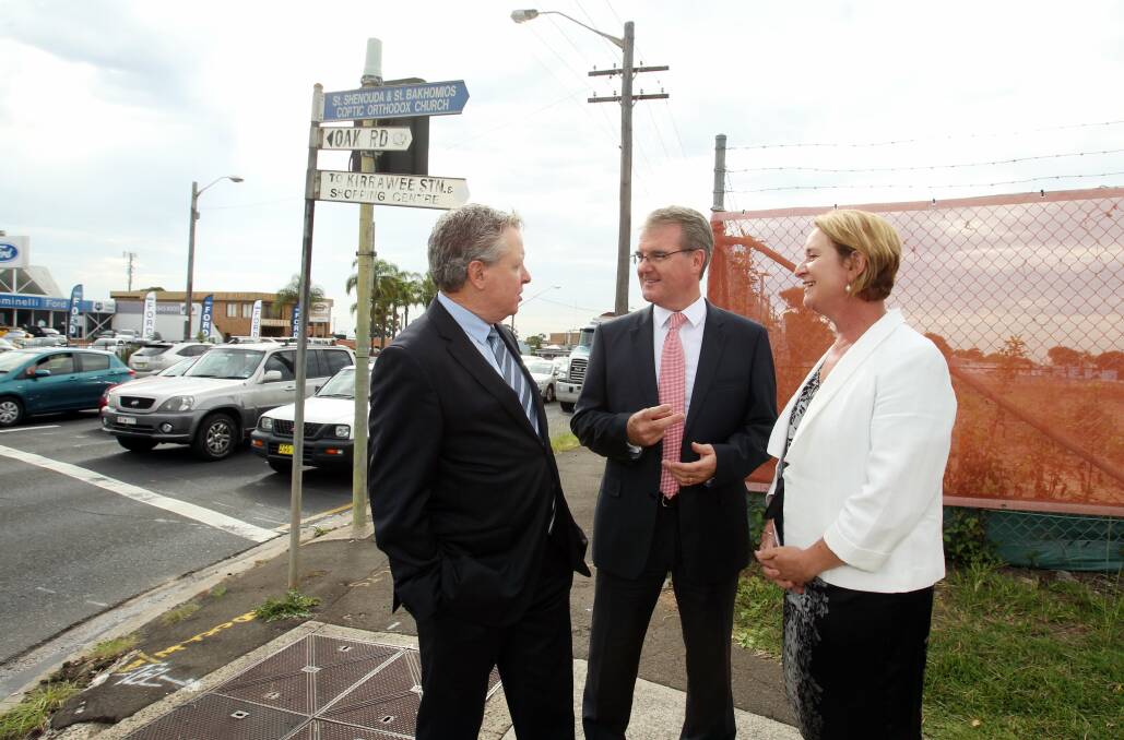 At the crossroads: Greg Holland (left) Michael Daley and Maryanne Stuart at the intersection of Princes Highway and Oak Road, next to the brick pit at Kirrawee. Picture: Chris Lane
