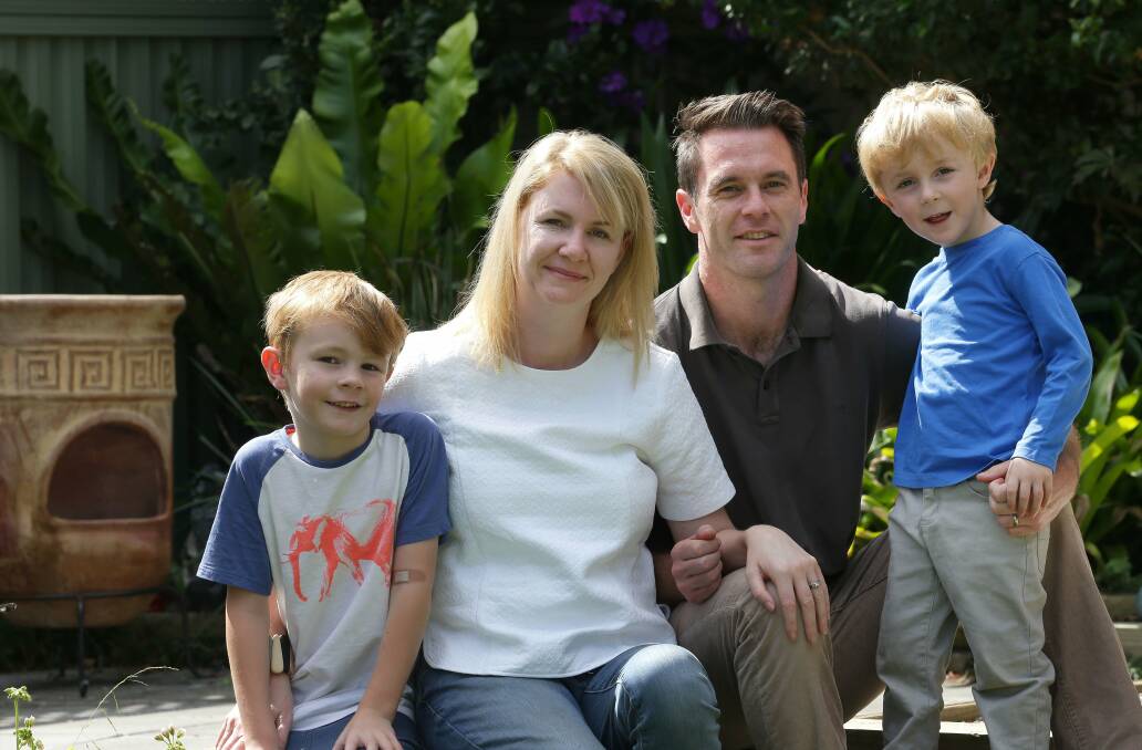 Swing: Chris and Anna Minns with their children Nicky, 4, and Joe, 6. Picture: John Veage