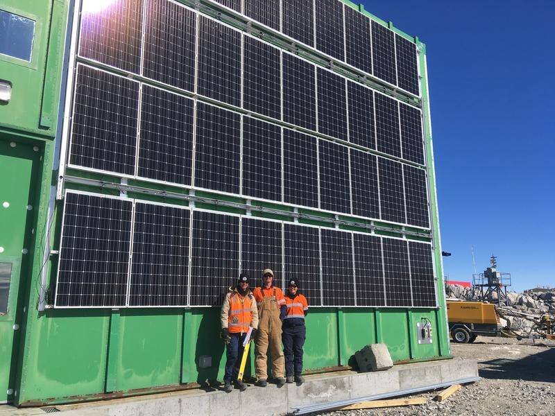 Conrad Willersdorf, Paulie Hanlon and Doreen McCurdy with the solar panel at Casey research station.
