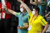 Australia's Chef de Mission Petria Thomas (r), wears a mask while watching swimming events. (Dave Hunt/AAP PHOTOS)