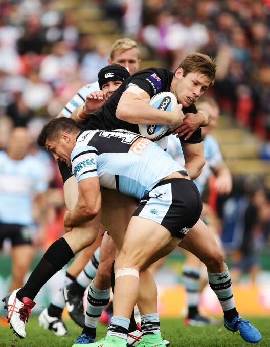 On report: Sharks forwards Chris Heighington (left) and Michael Ennis tackle Penrith prop Jeremy Latimore at Pepper Stadium. Picture: Matt King, Getty Images