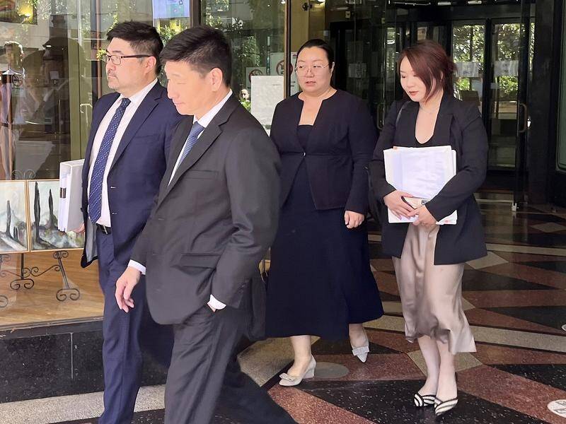 The jury is out in the manslaughter case of Jie Shao (2nd right) over a botched breast procedure. (Duncan Murray/AAP PHOTOS)