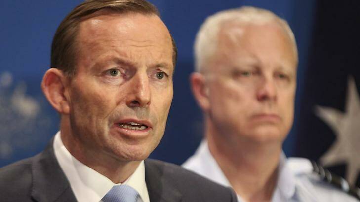 Tony Abbott speaks of Australia's military plans with the Chief of Defence, Air Chief Marshal Mark Binskin, in Darwin on Sunday. Photo: Office of the Prime Minister