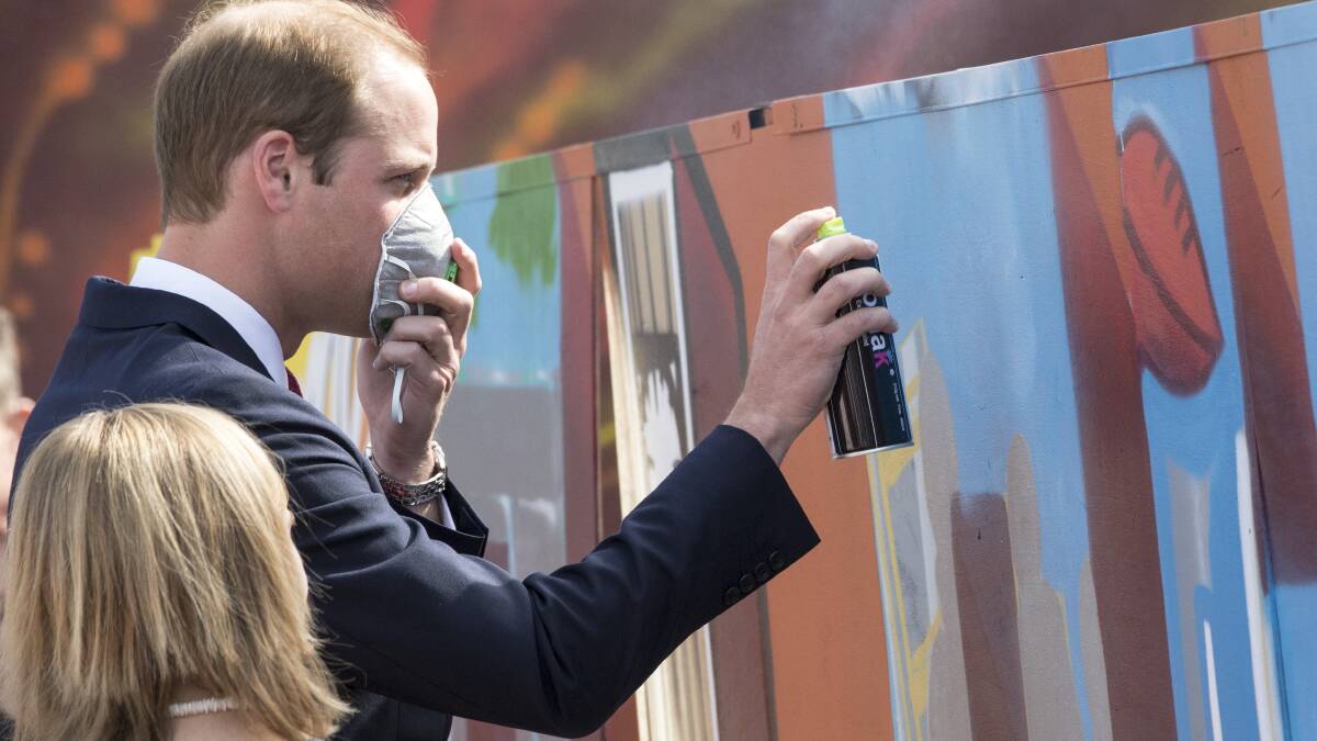 Prince William, Duke of Cambridge uses a spray can during his visit to a skate park in the Adelaide suburb of Elizabeth on April 23. Picture: Getty Images.