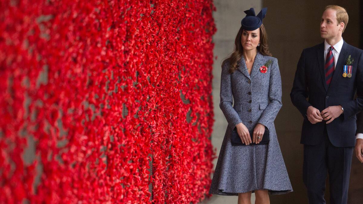 Catherine, Duchess of Cambridge and Prince William, Duke of Cambridge walk along the World War I Wall of Remembrance during their visit to the Australian War Memorial on Anzac Day in Canberra. Picture: Getty Images. 