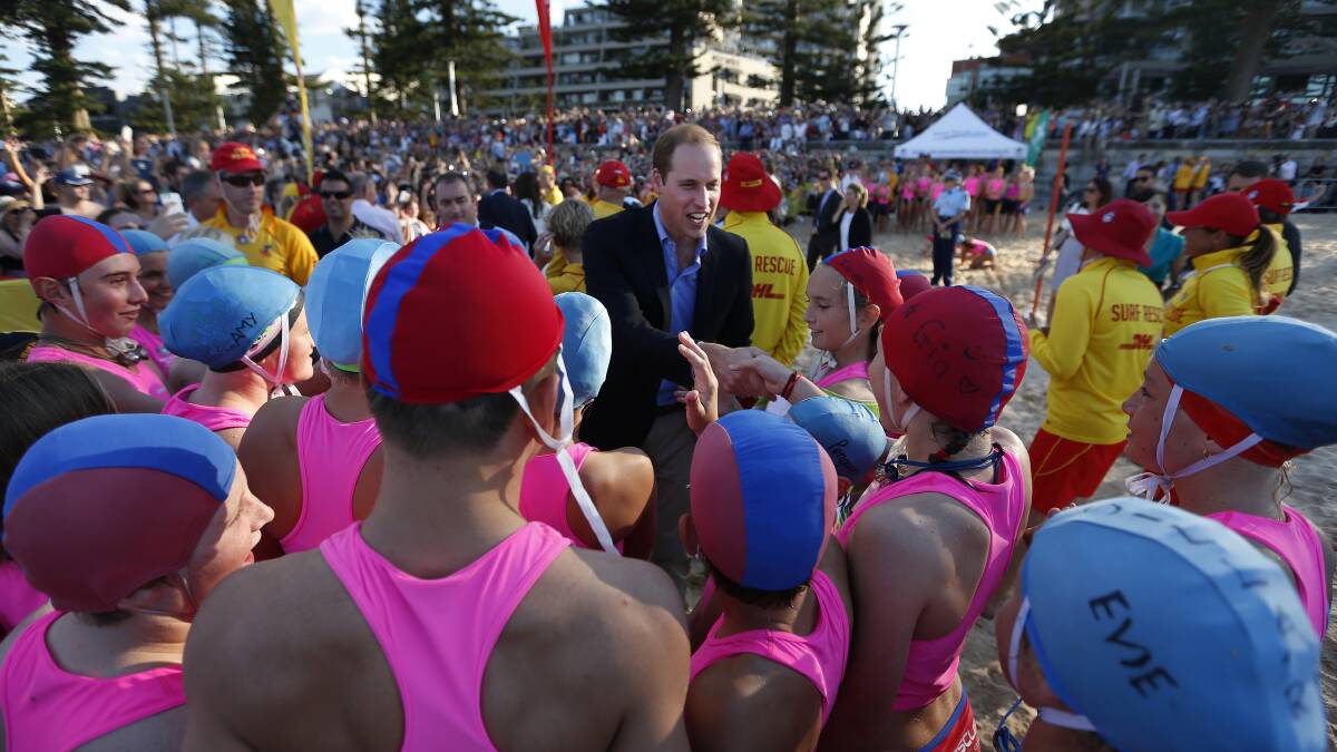 Prince William, Duke of Cambridge meets with young surf lifesavers during a surf lifesaving event on Manly Beach, April 18. Picture: Getty Images. 