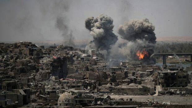 Airstrikes target Islamic State positions on the edge of the Old City in Mosul, Iraq in July.  Photo: Felipe Dana