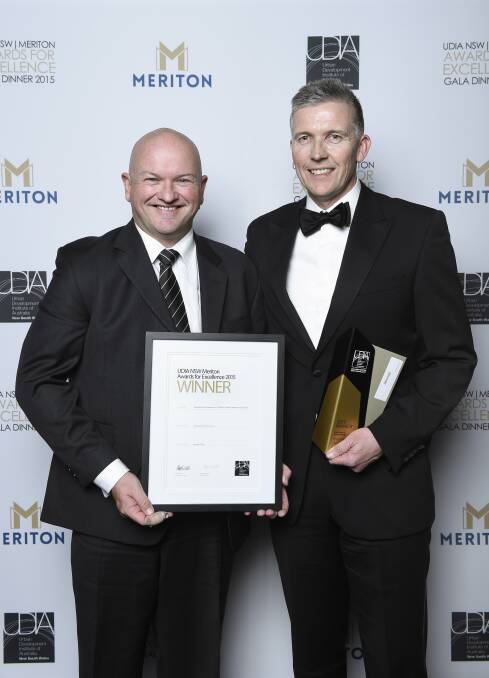 Recognition: Bluestone Property Solutions general manager development Matt Crews (left) and managing director Ben Fairfax with the UDIA award they received Friday night.
