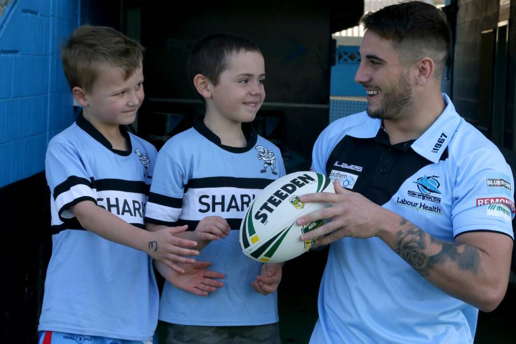 King of the kids: Cronulla five-eighth Jack Bird, here with fans Fletcher and Will, was named the Dally M Rookie of the Year on Monday night. Picture: Jane Dyson

