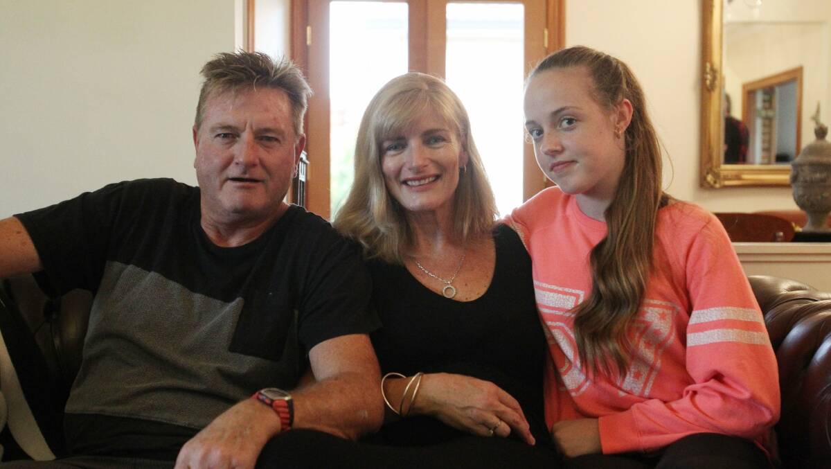 We are family: Gary and Donna Murray (pictured with their daughter Anabelle,14) are modern day superheroes. Picture: Chris Lane.
