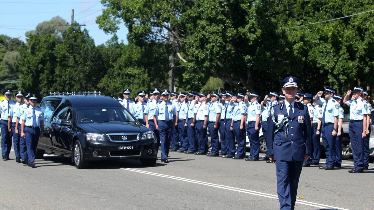 Last salute: NSW Police march at Cecil Abbott’s funeral at Penshurst yesterday. Below right, Mr Abbott. Picture: Chris Lane

