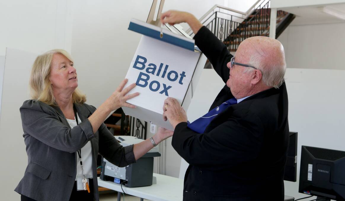 Lucky dip: Lesley Mannion (office manager) and Kerry Dixon (returning officer) conduct the draw for Oatley electorate. Picture: Jane Dyson

