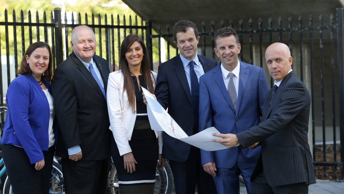 On your bike: The proposed route of the Sutherland-Cronulla shared cycle-walk path is released by Transport Minister Andrew Constance (second from right) and project manager Dean Boston (far right), with MPs (from left) Melanie Gibbons, Lee Evans, Eleni Petinos and Mark Speakman. Picture: John Veage.
