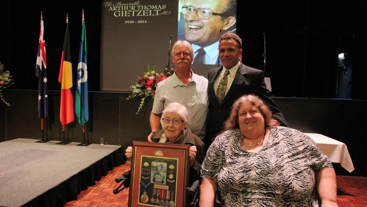 Loved by many: Arthur Gietzel’s wife, Dawn, with children Lee and Adam (back) and Dale (front) at the state memorial service at Sutherland Entertainment Centre. Picture: Chris Lane

