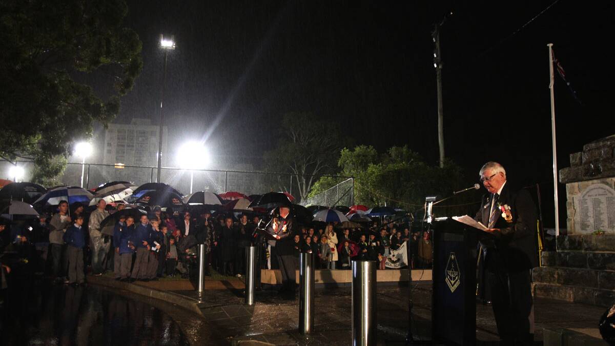 Tribute: Anzac Day Services in Sutherland Shire, including this one at Miranda, drew crowds this morning despite the rain. Picture: Chris Lane